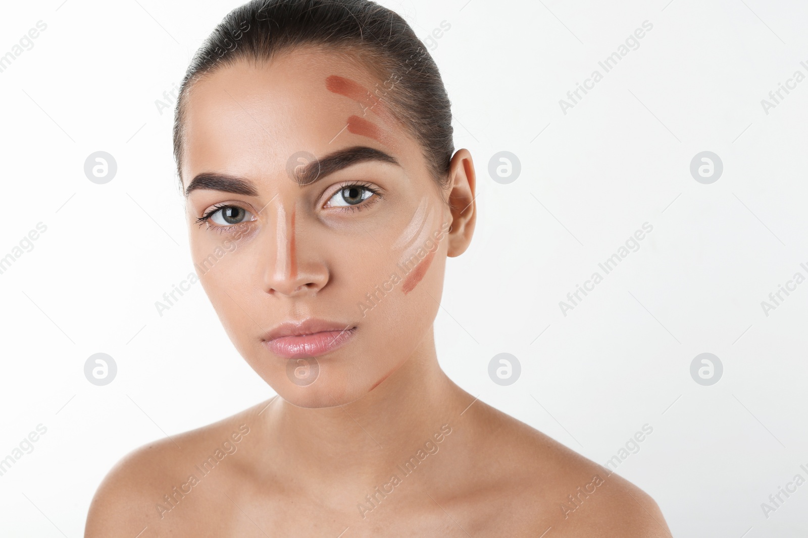 Photo of Portrait of beautiful woman with makeup contouring lines on white background