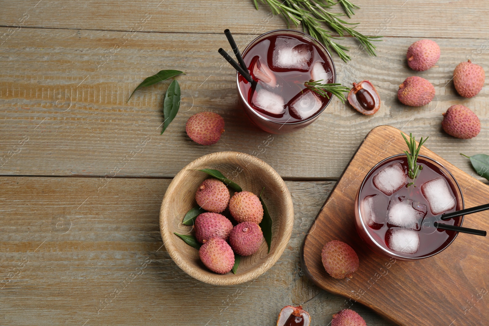 Photo of Flat lay composition with delicious lychee cocktails on wooden table. Space for text