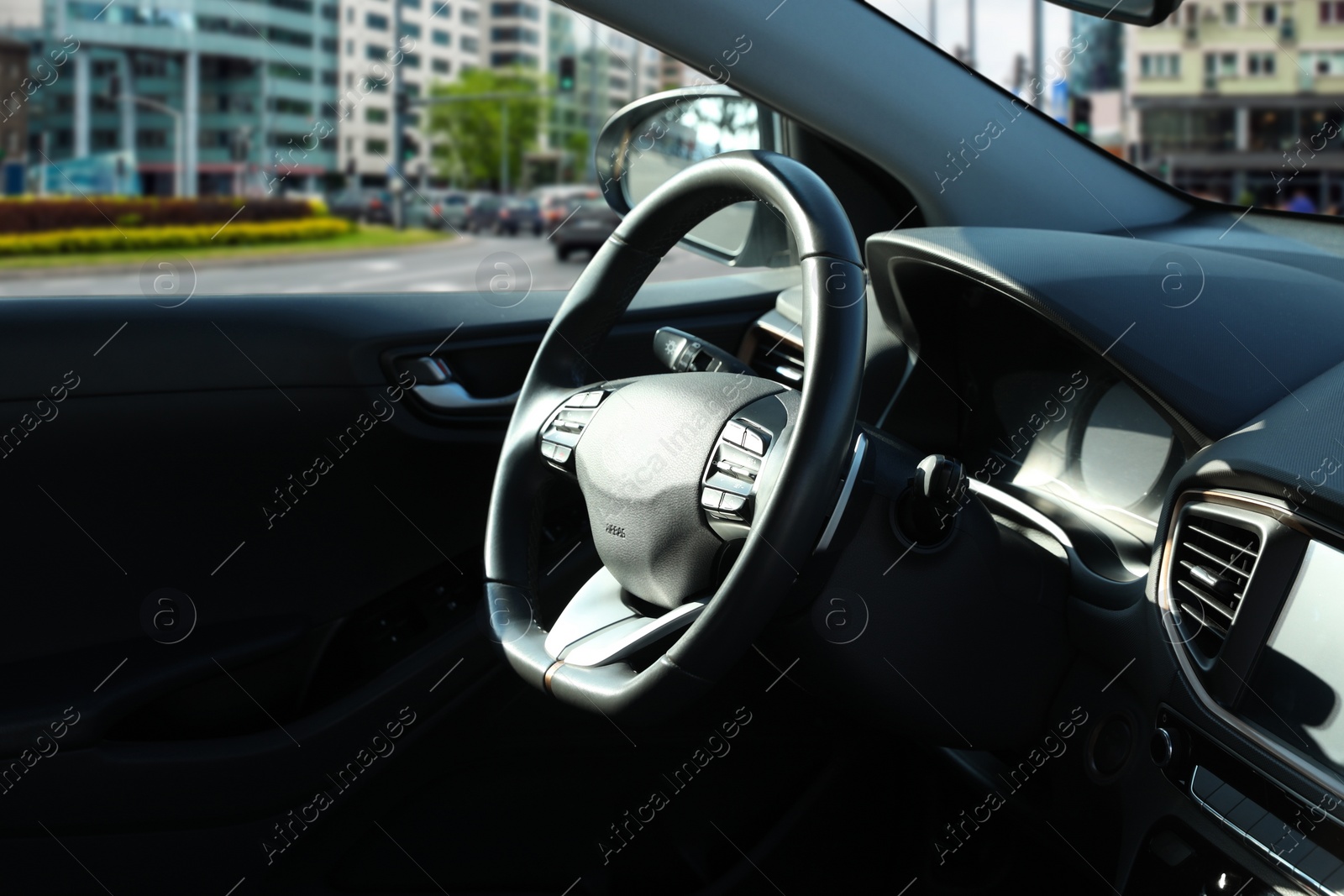 Image of Steering wheel and dashboard in modern car