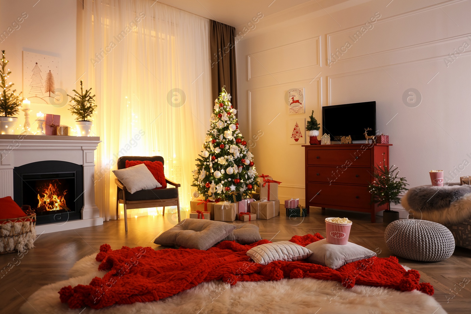 Photo of Stylish living room interior with TV set, Christmas tree and fireplace