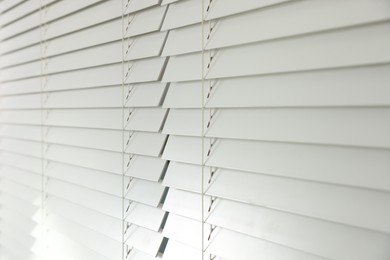 Closeup view of horizontal blinds on window indoors