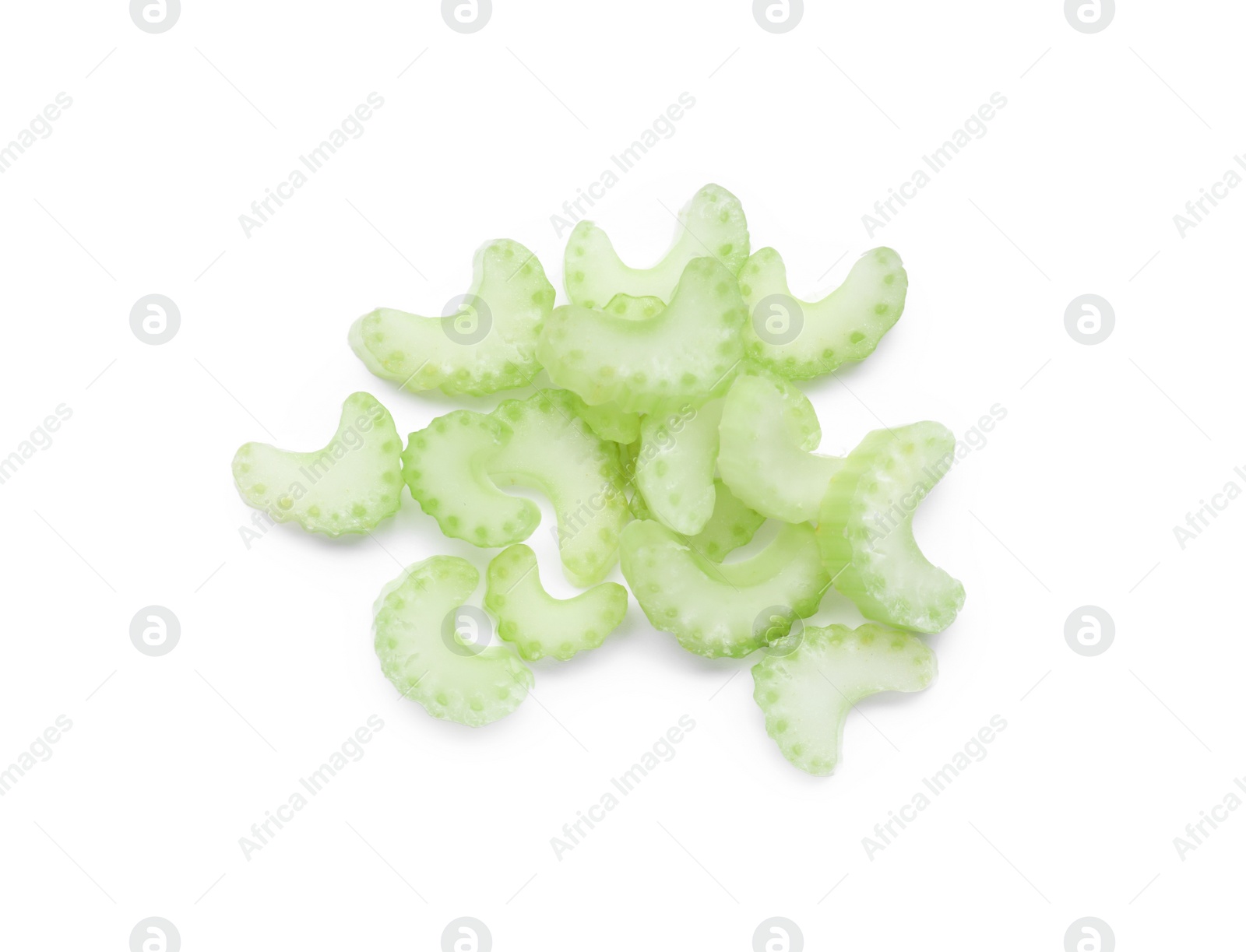 Photo of Heap of fresh cut celery isolated on white, top view