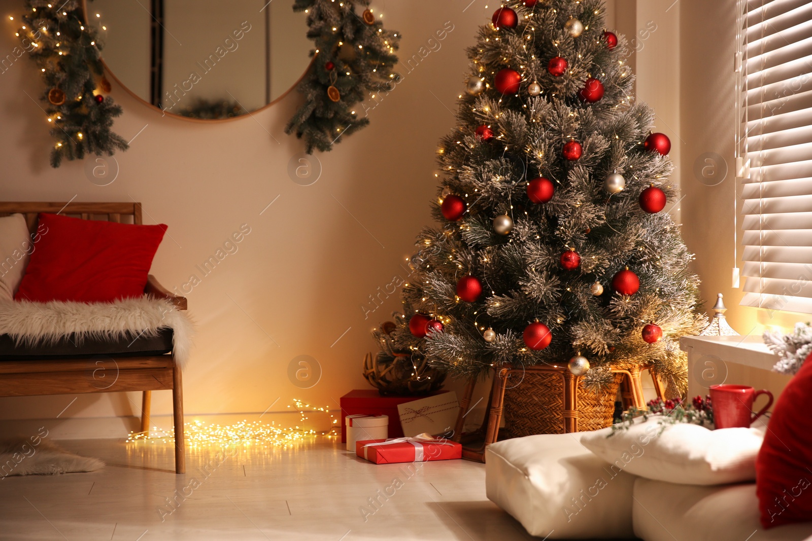 Photo of Beautiful decorated Christmas tree in festive room interior