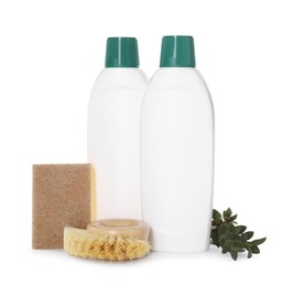 Photo of Bottles of cleaning product, sponge, brush and floral decor isolated on white