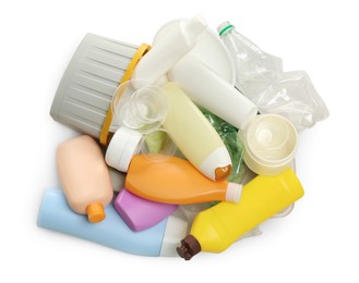 Pile of plastic garbage on white background, top view