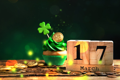 Image of Composition with block calendar on wooden table. St. Patrick's Day celebration