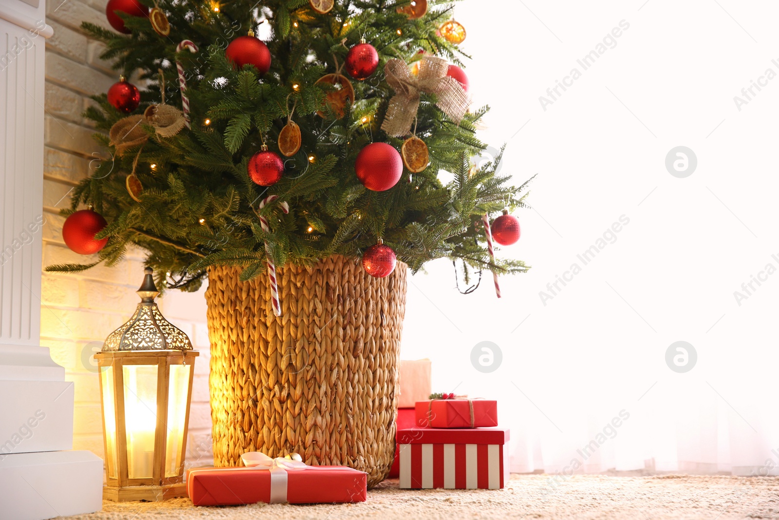 Photo of Beautiful decorated Christmas tree in festive room interior