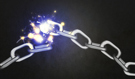 Image of Broken metal chain on black background. Freedom concept 