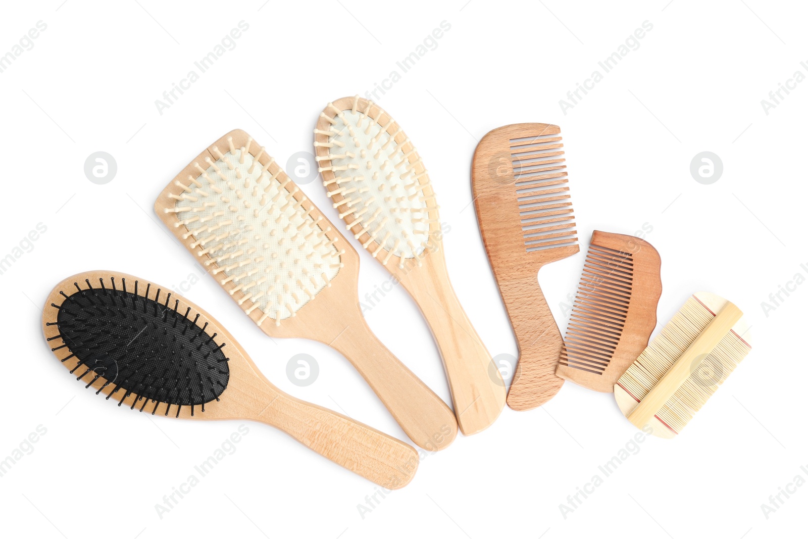 Photo of Set of modern hair combs and brushes isolated on white, top view