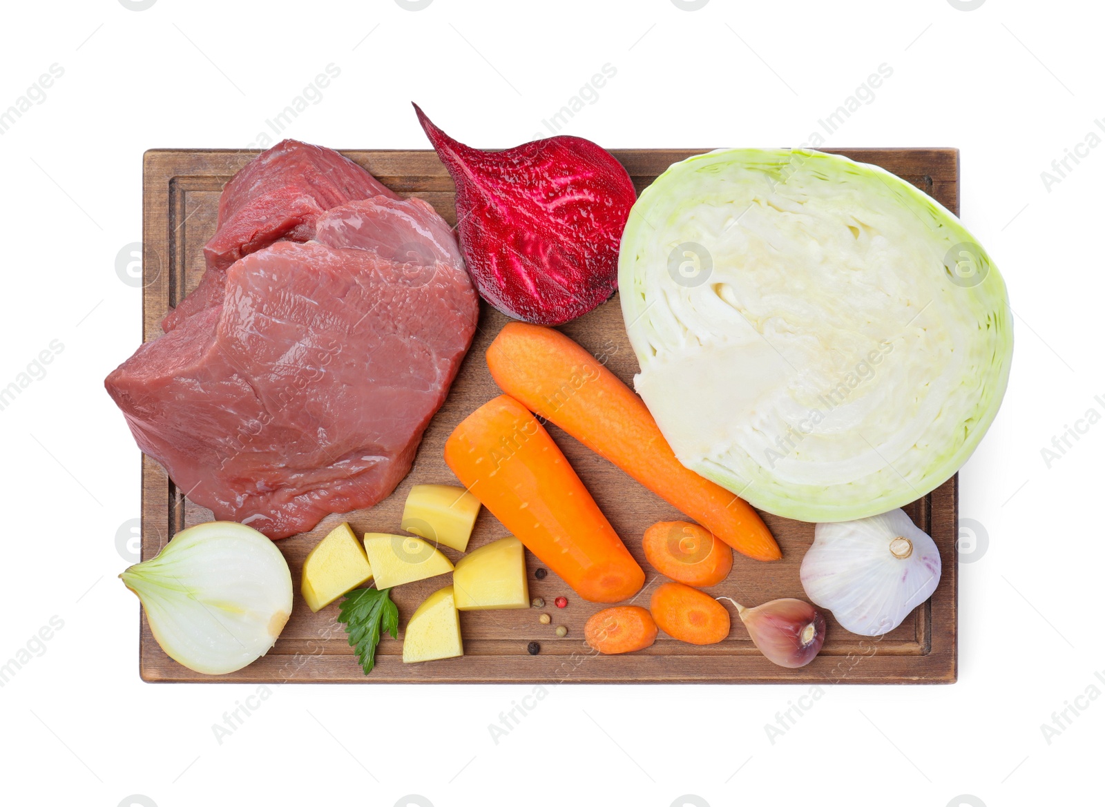 Photo of Ingredients for traditional borscht on white background, top view