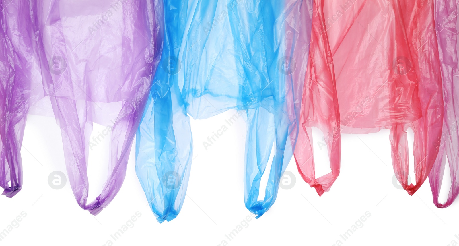 Photo of Many different plastic bags on white background