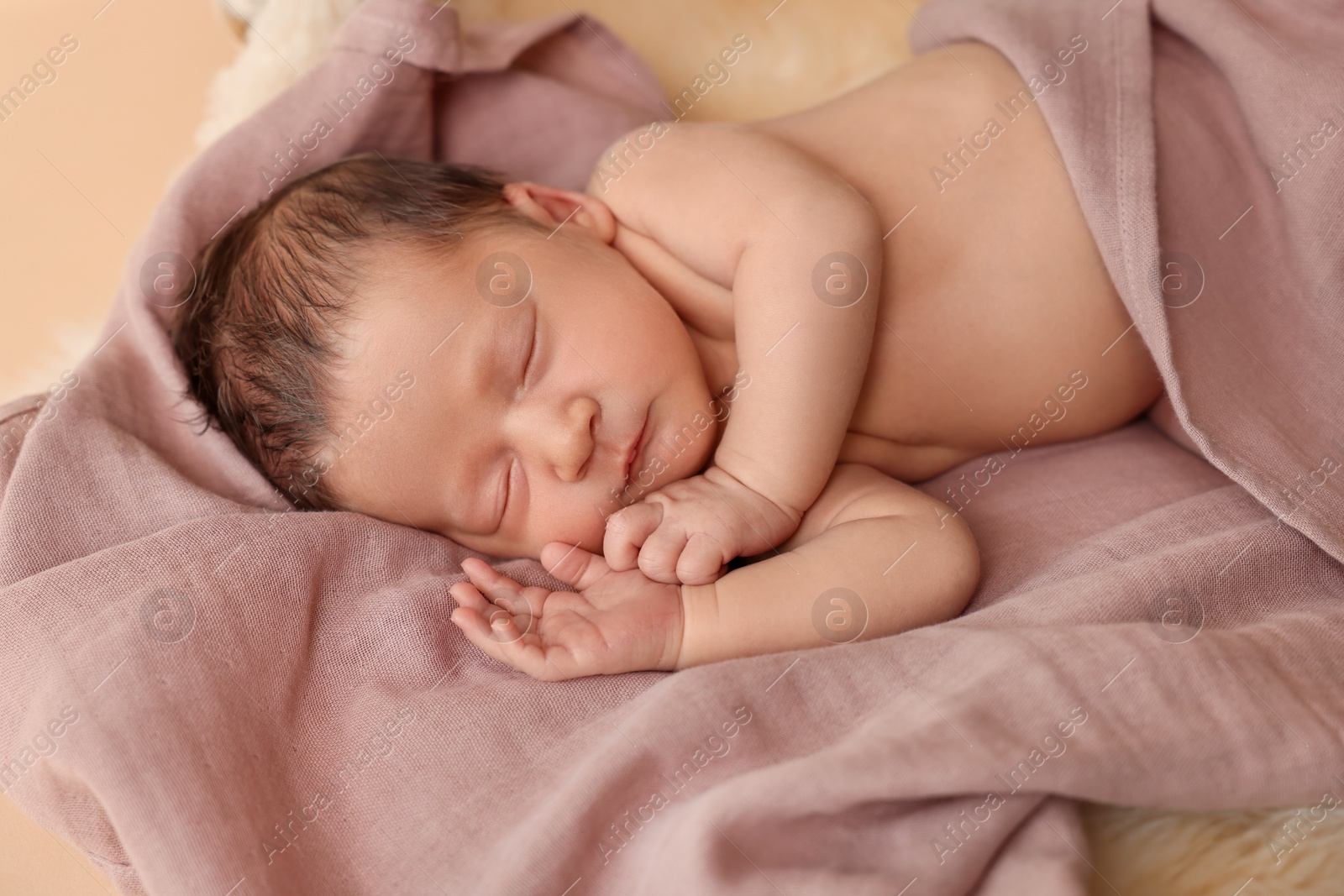 Photo of Adorable newborn baby sleeping on light brown blanket