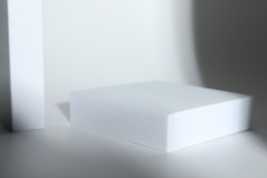 Photo of Presentation of product. Podium on white background, space for text