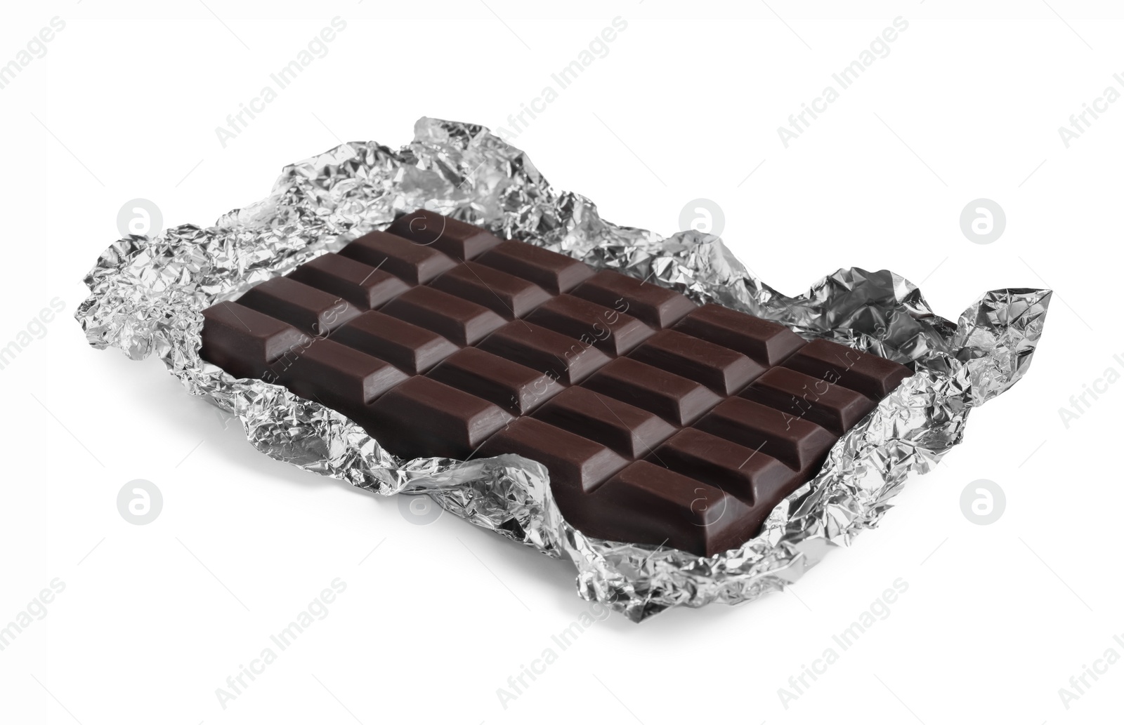 Photo of Delicious dark chocolate bar with foil isolated on white