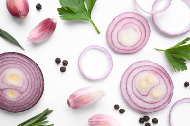 Photo of Flat lay composition with cut onion and spices on white background