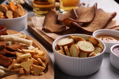 Photo of Many different crispy rusks served on light table
