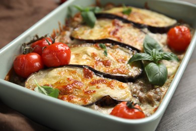 Photo of Delicious eggplant lasagna in baking dish on table, closeup