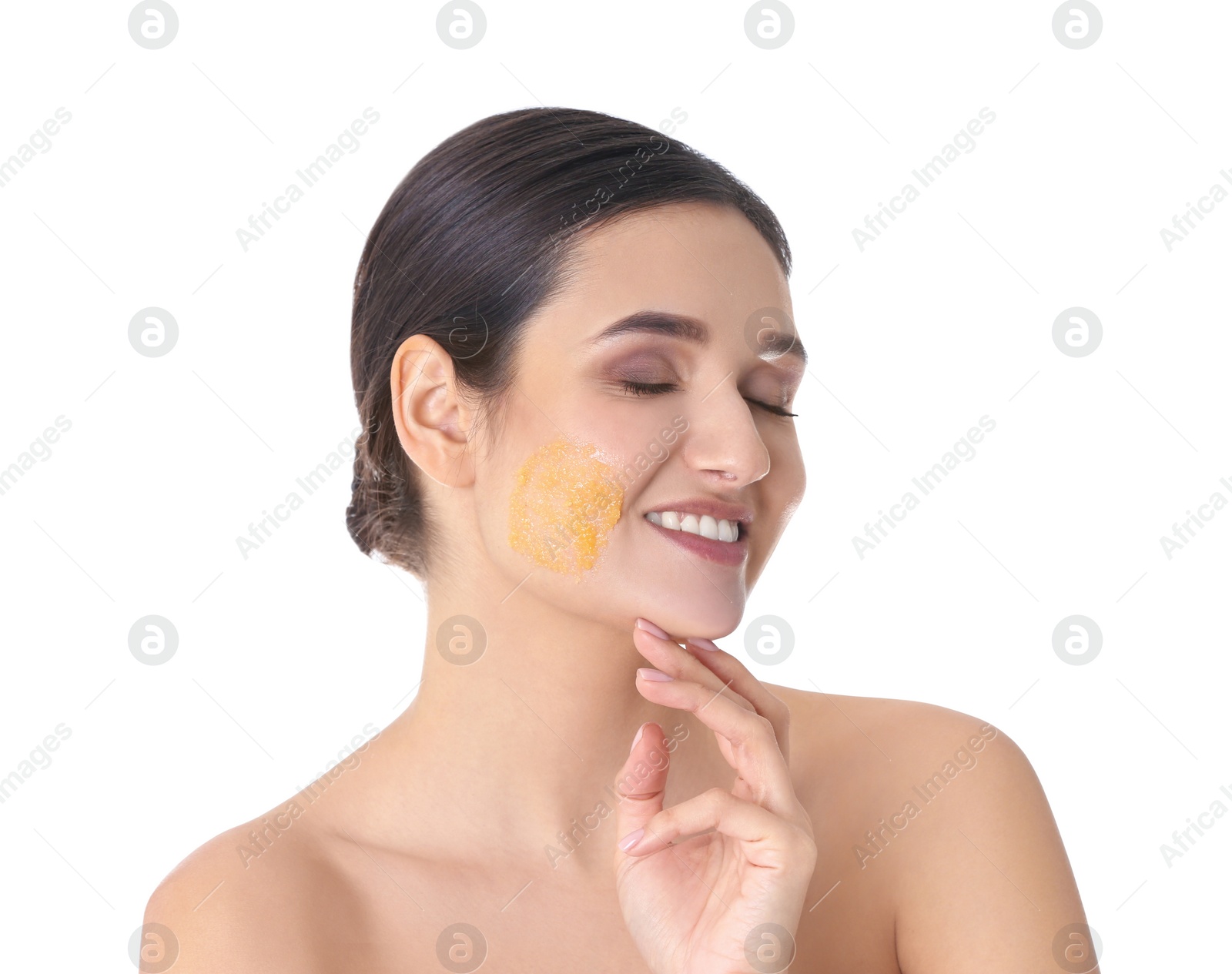 Photo of Young woman with natural scrub on her face against white background