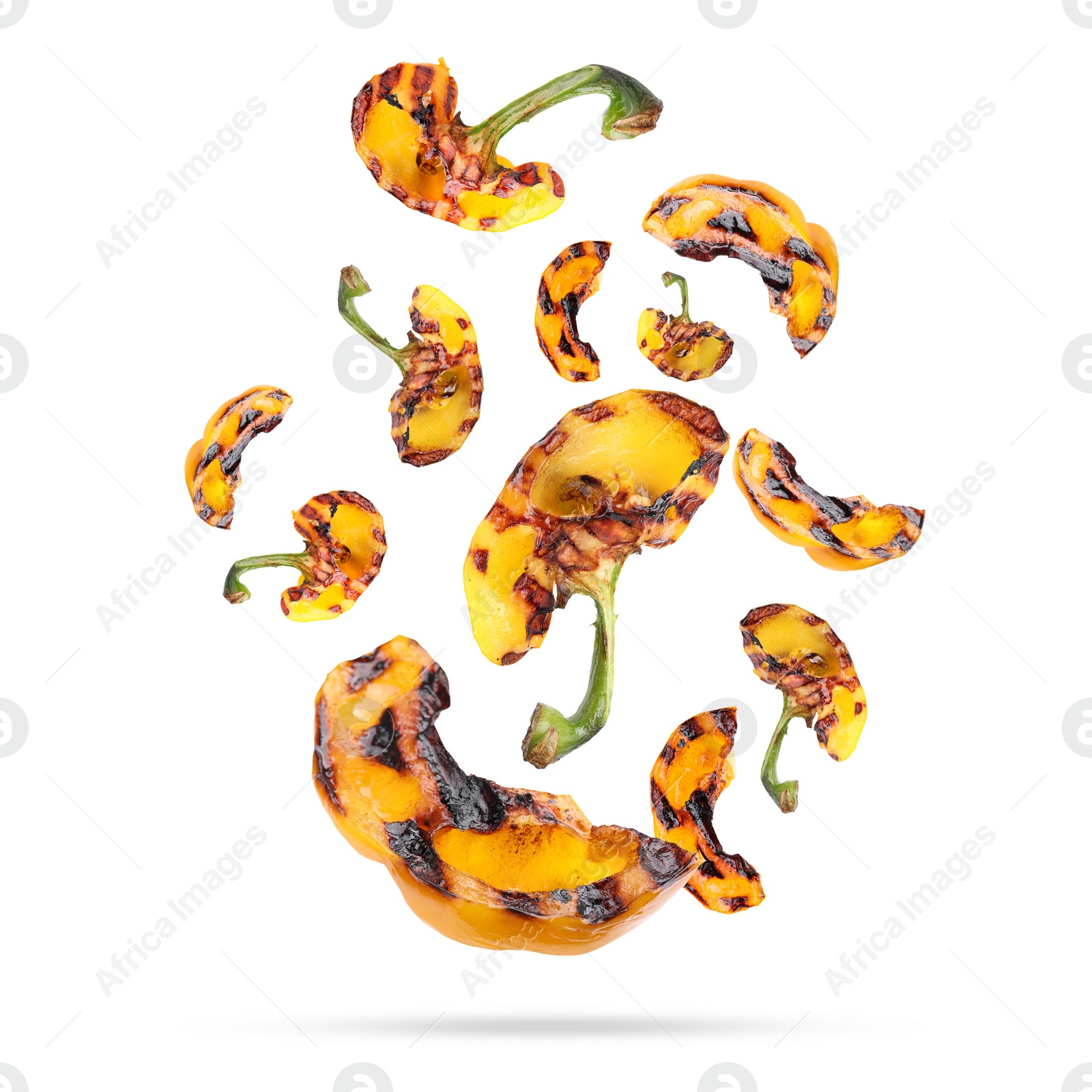 Image of Slices of grilled bell peppers in air on white background