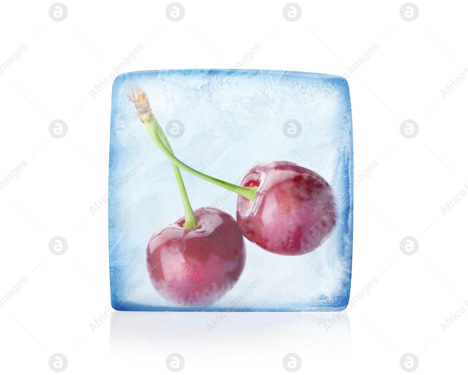 Image of Frozen food. Raw cherries in ice cube isolated on white