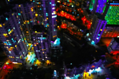 Blurred view of city with buildings at night