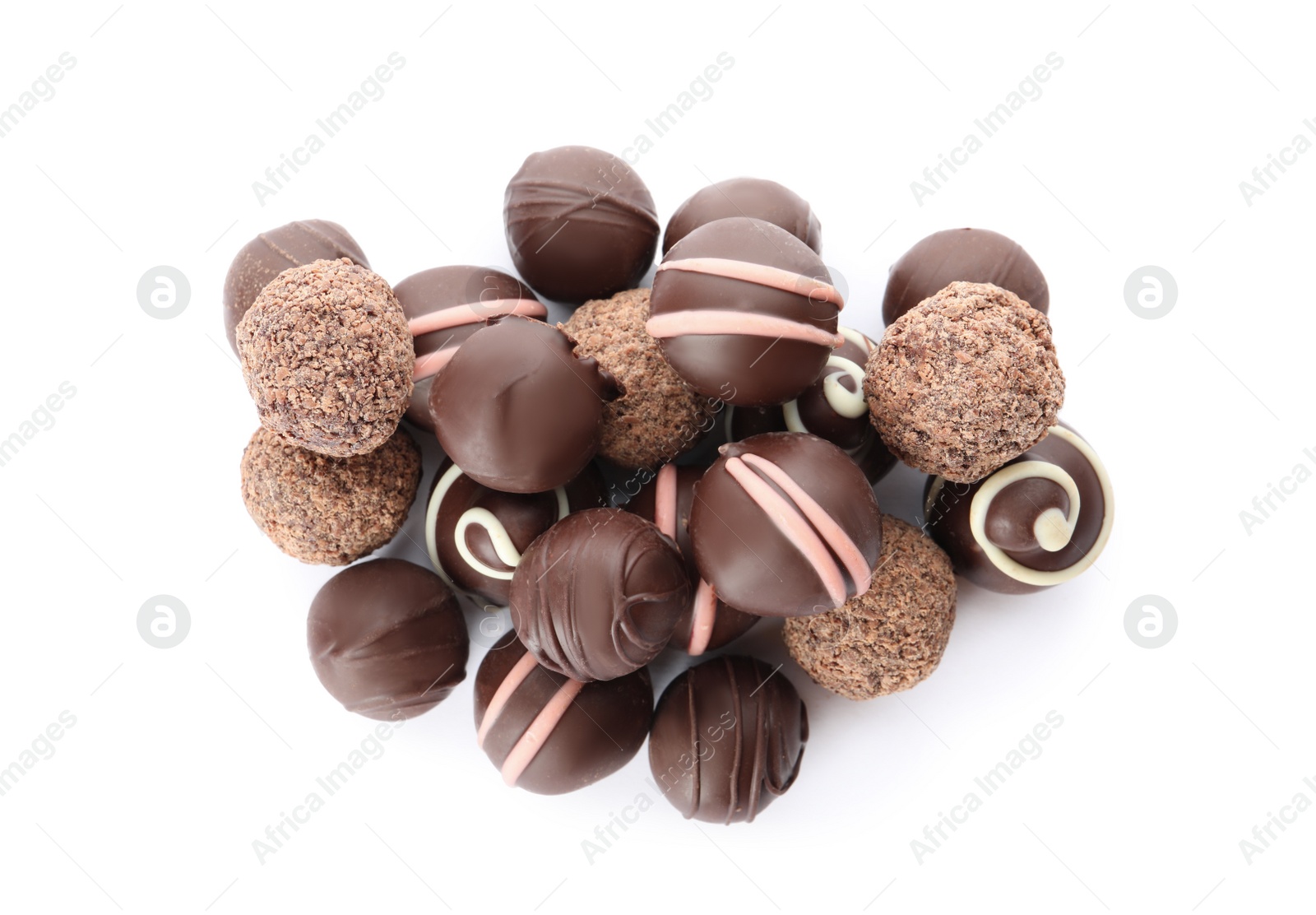 Photo of Many different delicious chocolate truffles on white background, top view