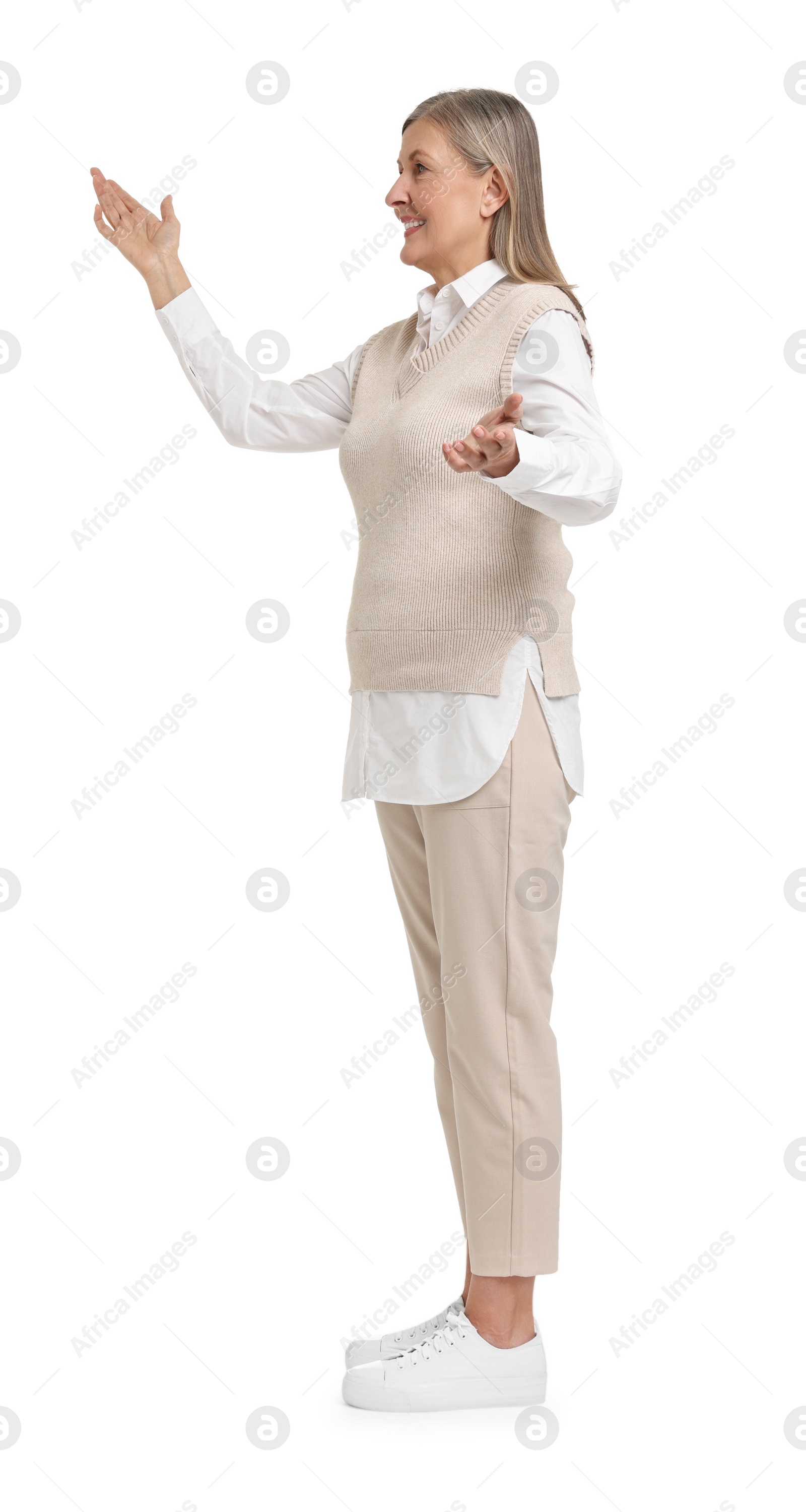 Photo of Senior woman greeting someone on white background