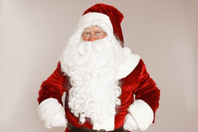 Photo of Happy authentic Santa Claus on grey background