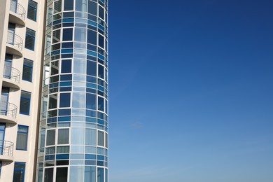 Photo of Beautiful skyscraper against blue sky on sunny day