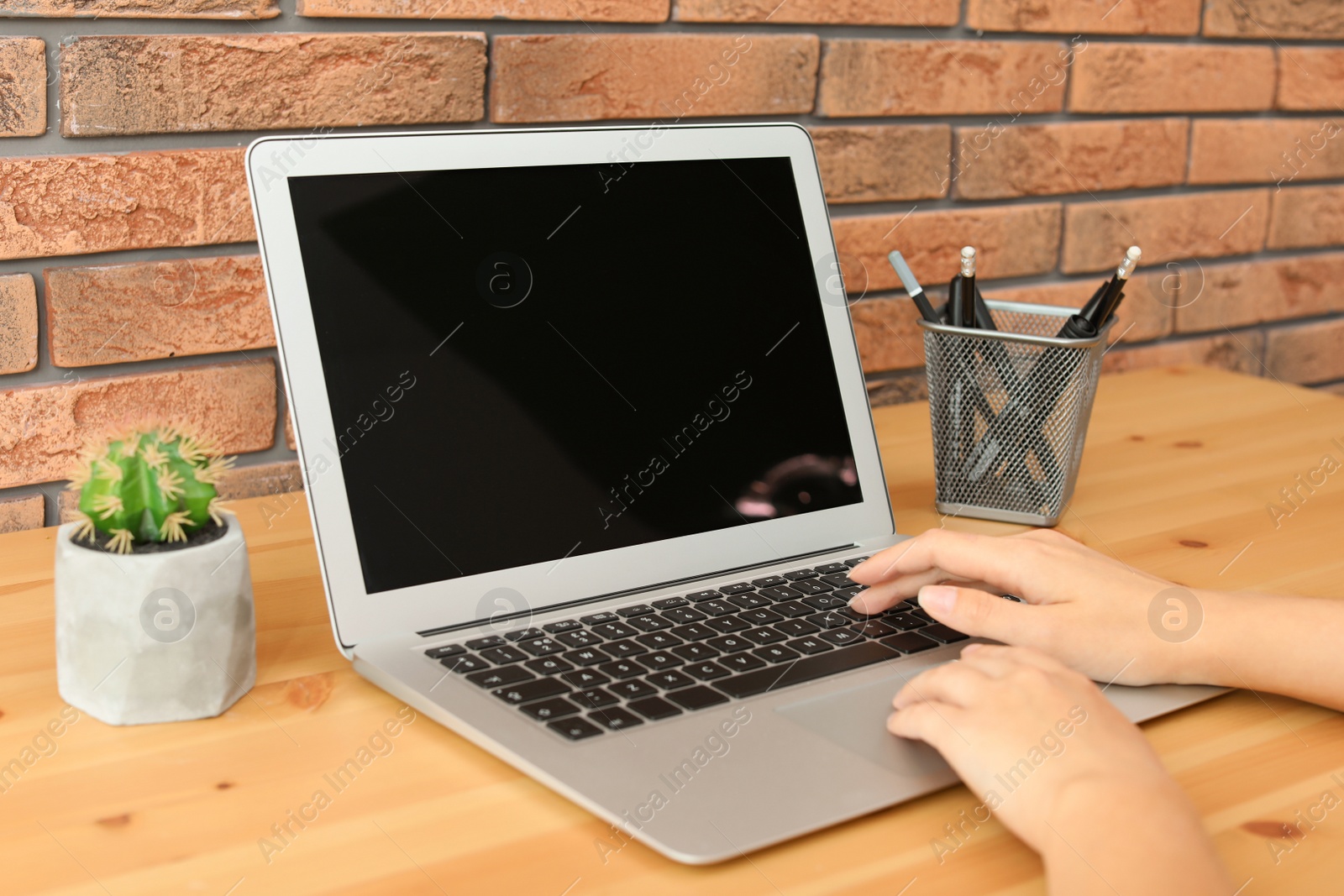 Photo of Woman working with laptop at home. Mock up with space for text