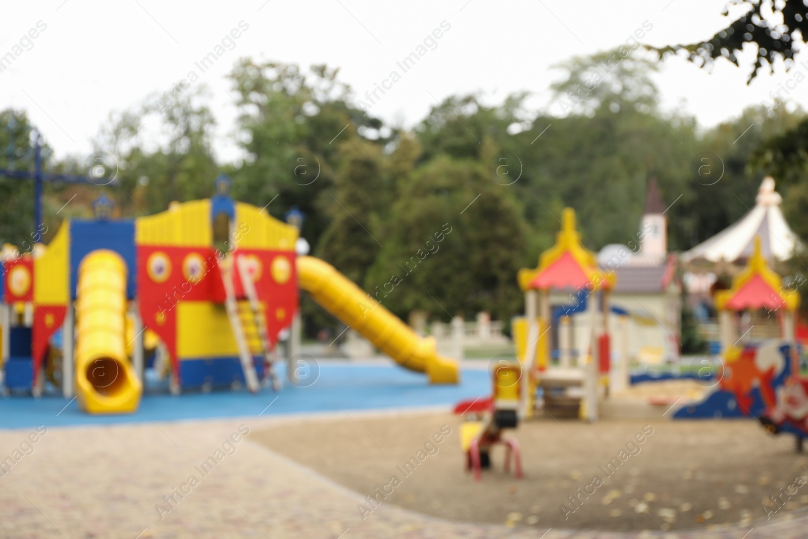 Photo of Blurred view of children's playground on autumn day