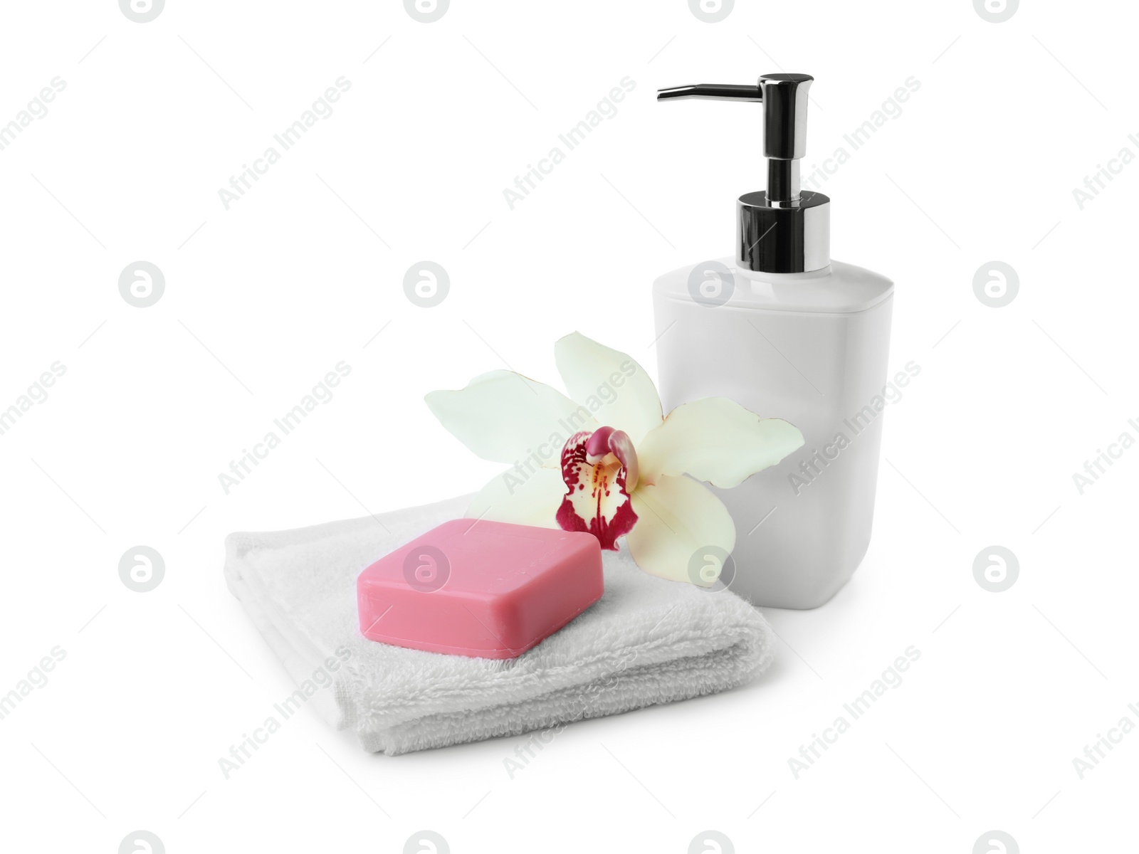 Photo of Soap bar, dispenser and terry towel on white background