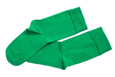 Pair of green socks on white background, top view