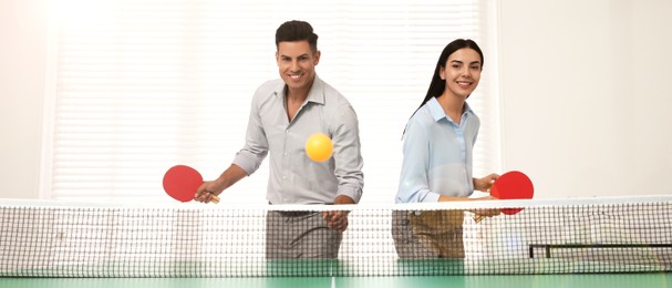 Image of Business people playing ping pong in office. Banner design