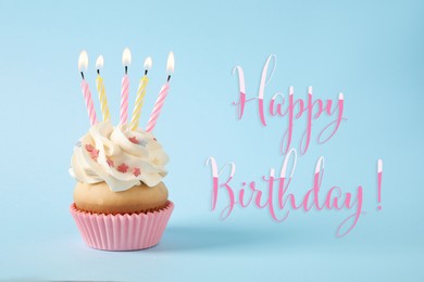 Image of Happy Birthday! Delicious cupcake with candles on light blue background 