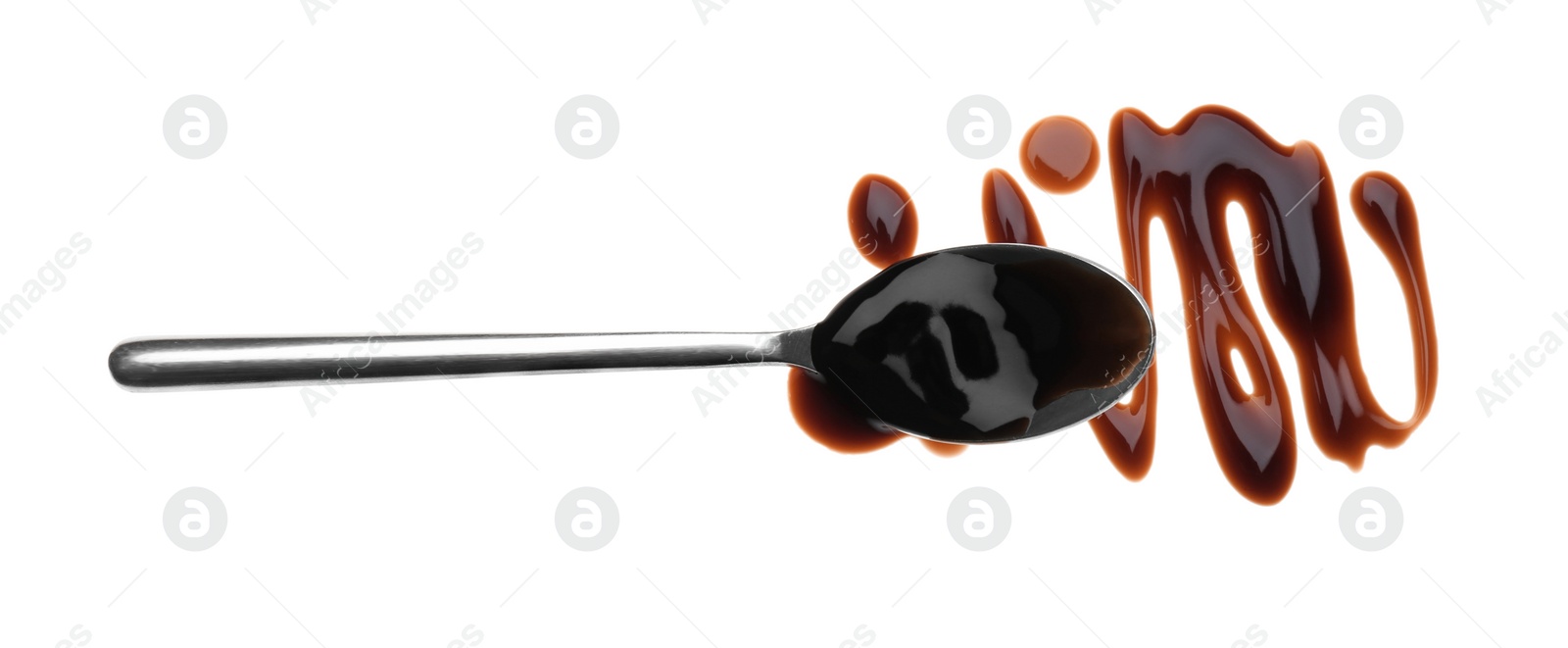 Photo of Smear of soy sauce and spoon on white background, top view