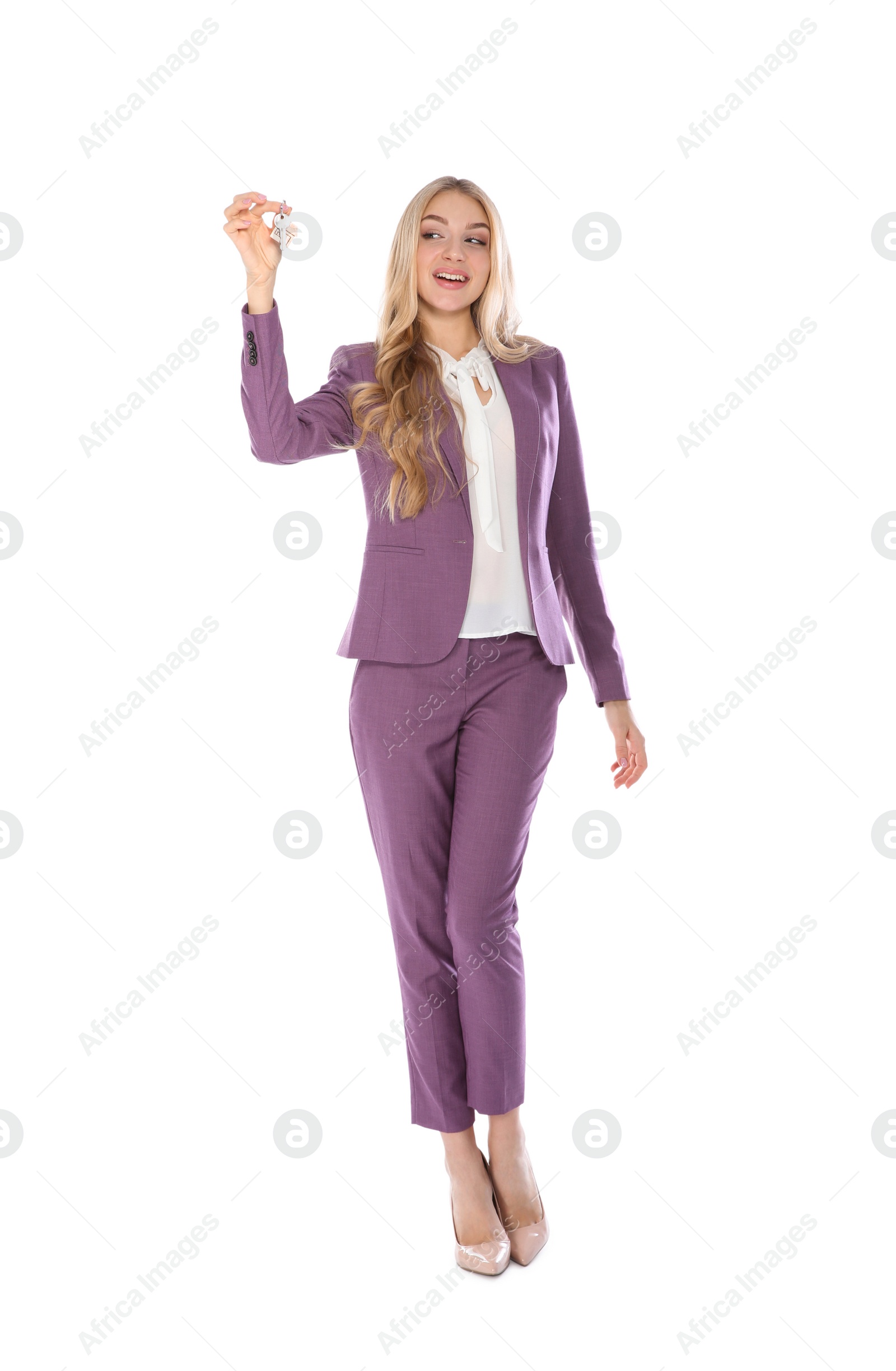 Photo of Happy young businesswoman with house key on white background