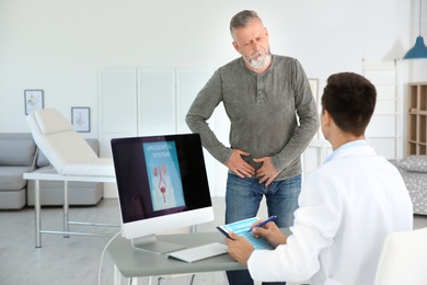 Photo of Man with health problem visiting urologist at hospital