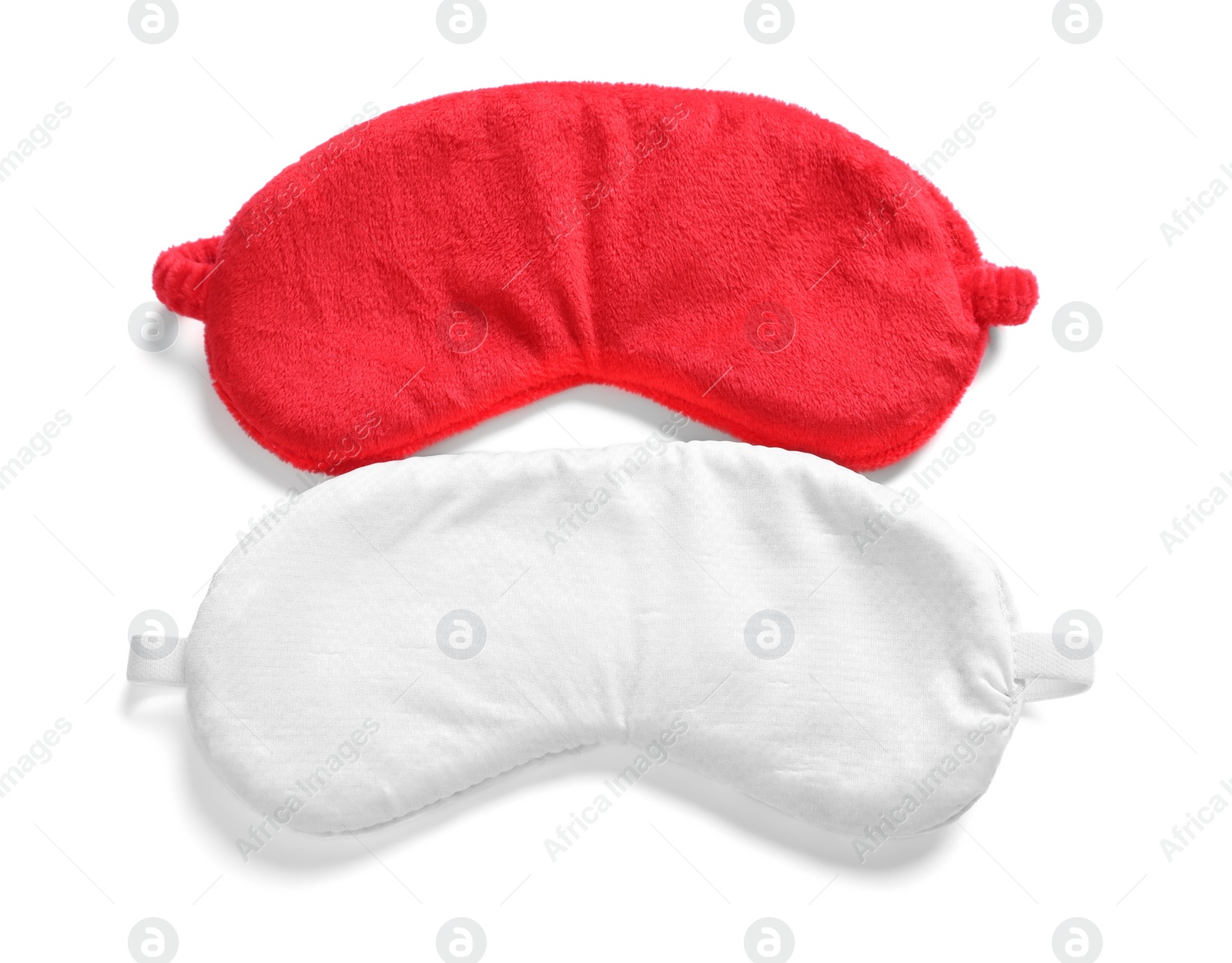 Photo of Two soft sleep masks isolated on white, top view