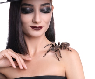 Photo of Mysterious witch with spider on white background, closeup