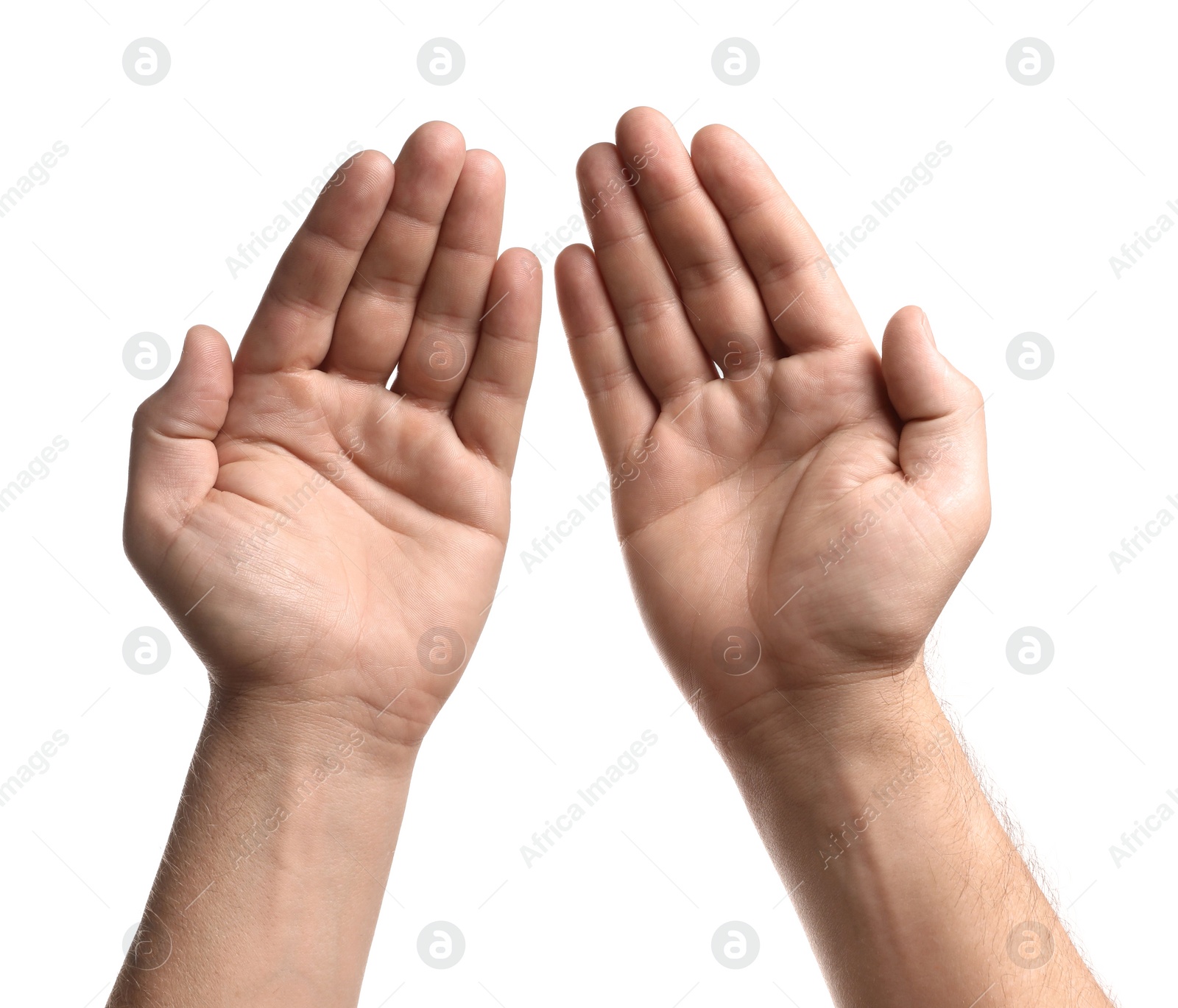 Photo of Religion. Man with open palms praying on white background, closeup