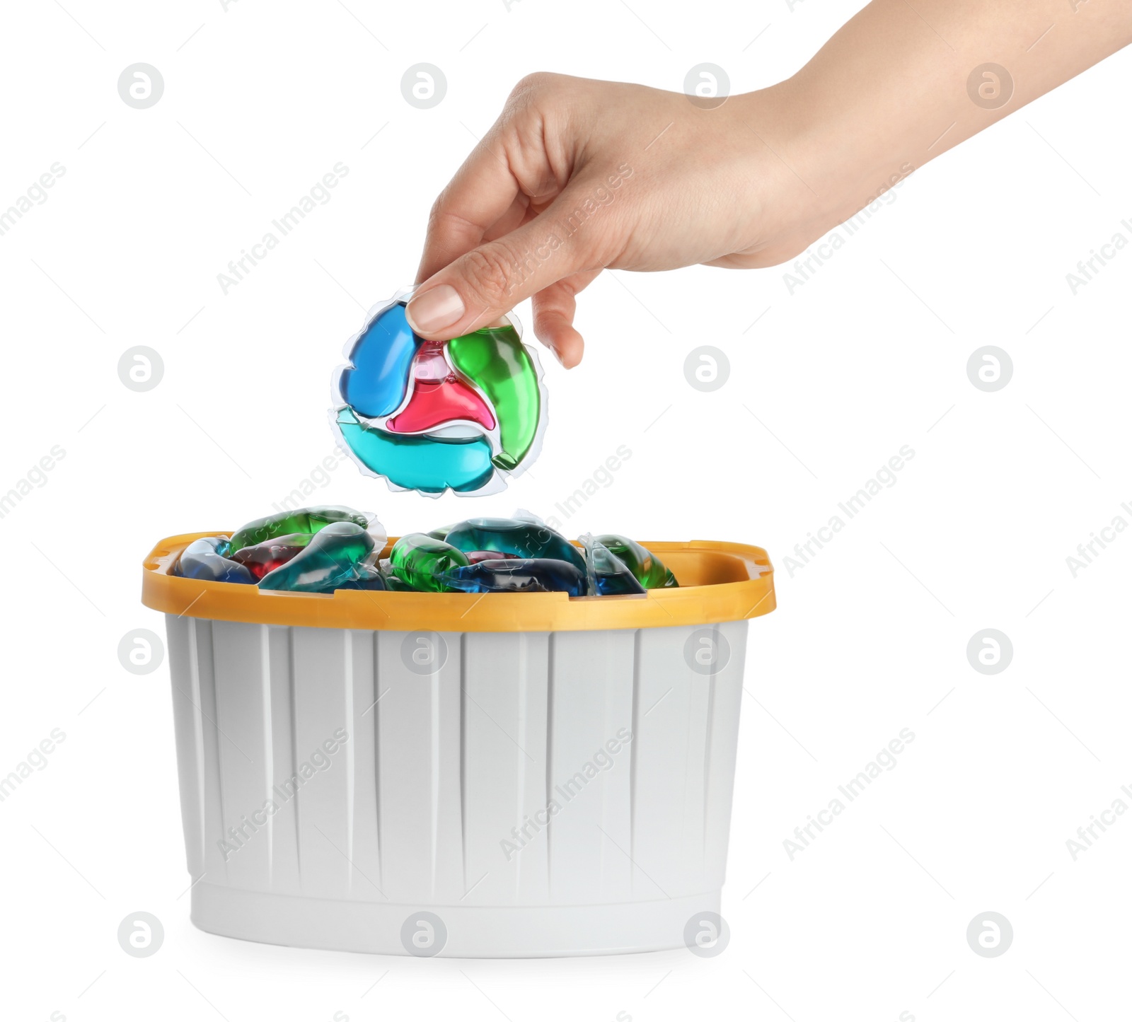 Photo of Woman taking laundry capsule out of box against white background, closeup