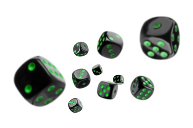 Image of Ten black dice in air on white background