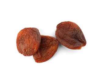 Photo of Tasty dried apricots on white background, top view