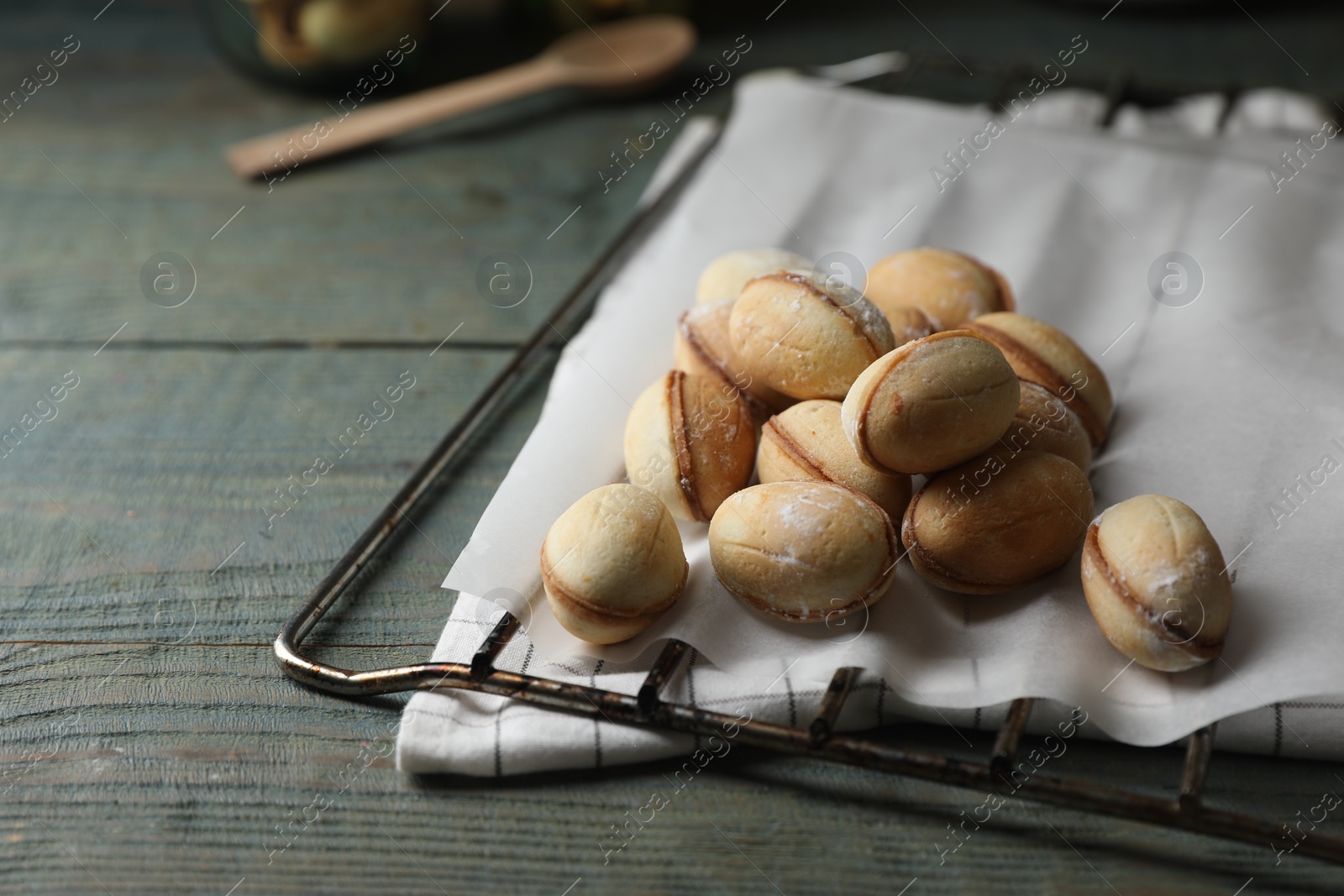 Photo of Freshly baked homemade walnut shaped cookies, closeup. Space for text