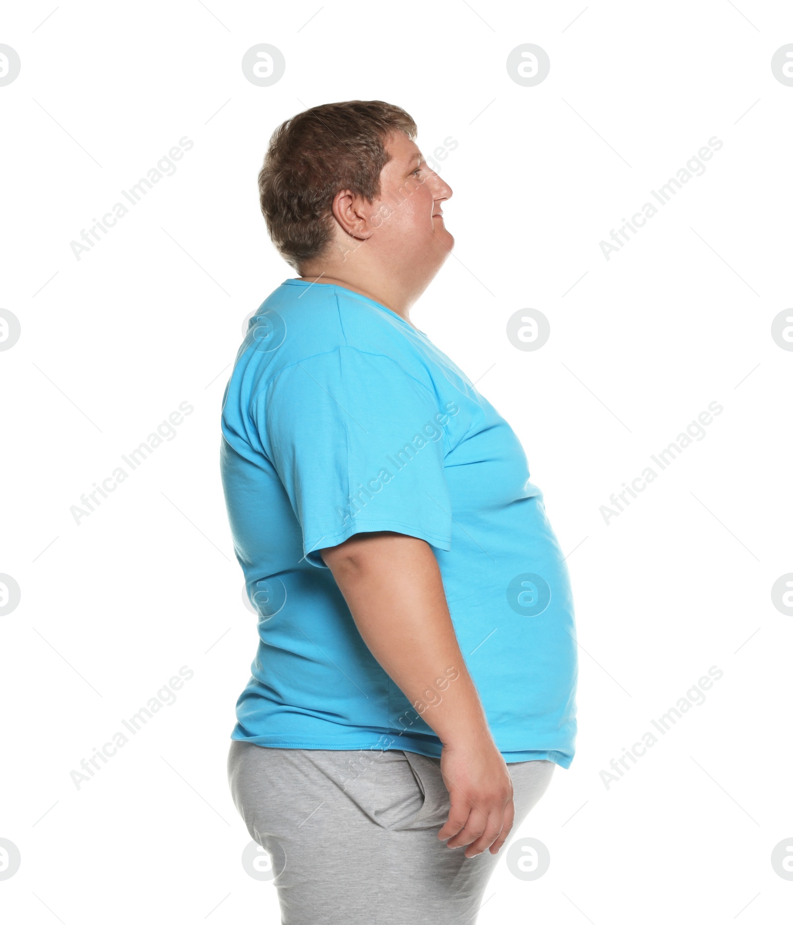 Photo of Portrait of overweight man posing on white background