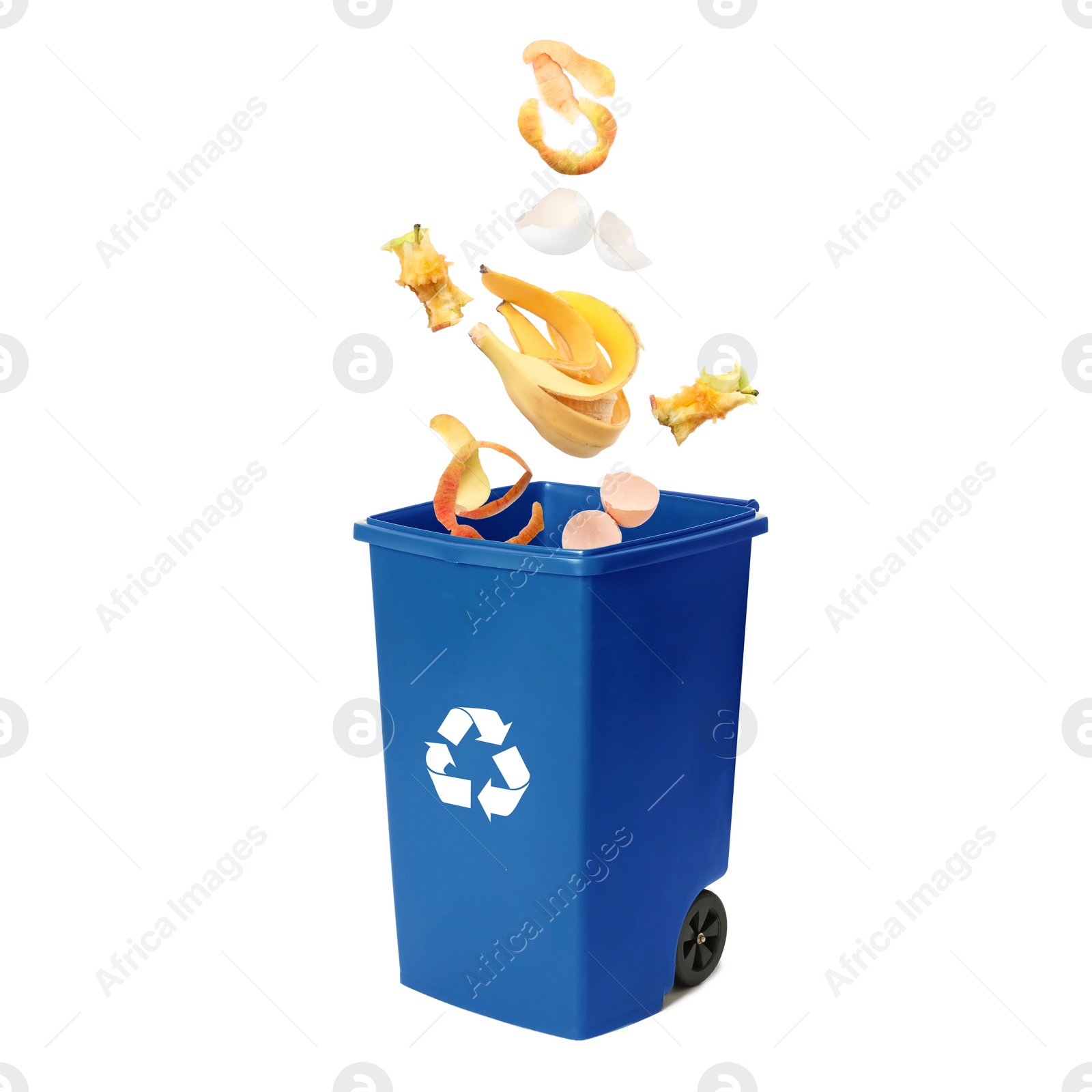 Image of Garbage falling into trash bin on white background