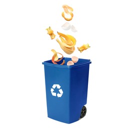 Image of Garbage falling into trash bin on white background