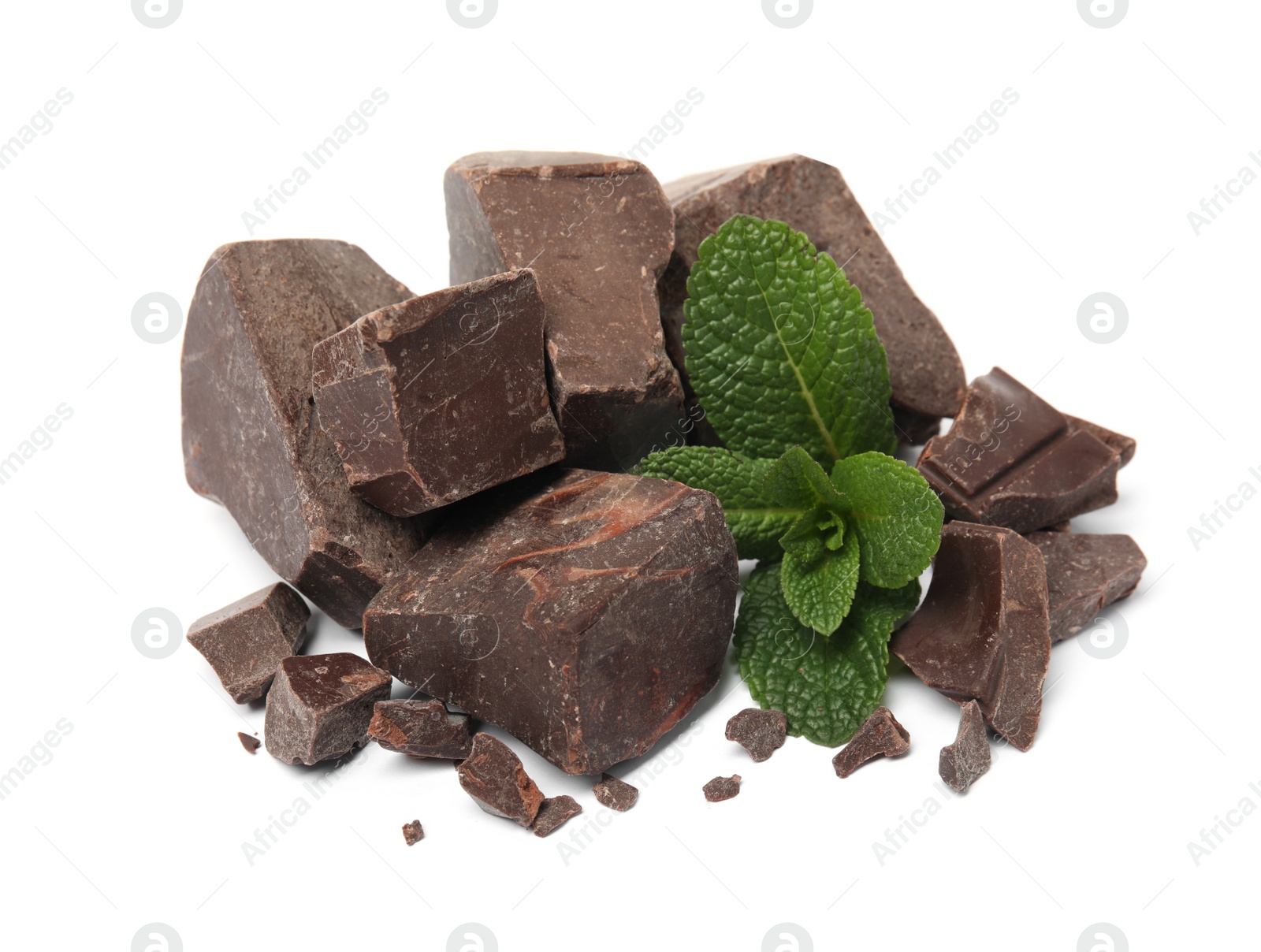 Photo of Tasty dark chocolate pieces with mint on white background