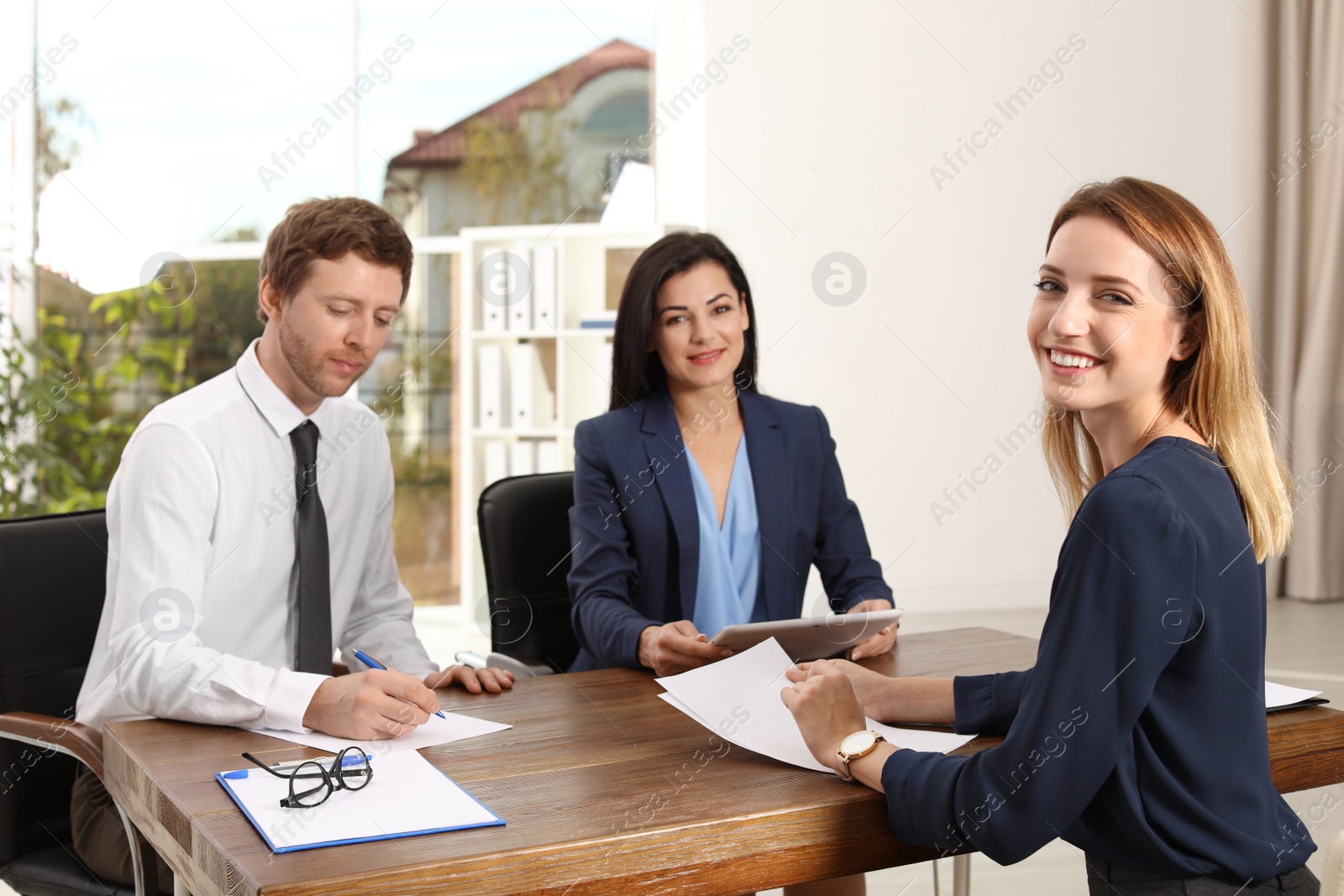 Photo of Human resources commission conducting job interview with applicant in office